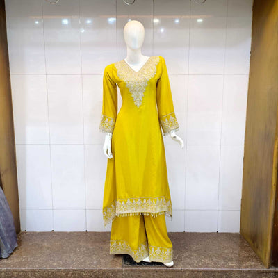 C cut long kameez with Plazzo in Italian crepe featuring fine kasab embroidery, ideal for festive and traditional occasions.