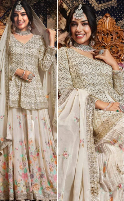 Elegant off-white Kurti palazzo with intricate silver sequin embroidery and vibrant floral motifs, paired with a sheer embroidered dupatta; ideal for weddings and festive occasions.