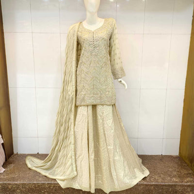 gold Short kameez sharara with delicate embroidery, ideal for weddings.