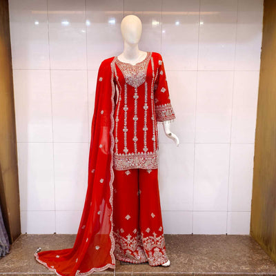 burnt orange short kameez with sharara set featuring intricate embroidery displayed on a mannequin.