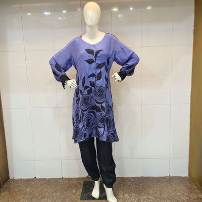 Straight purple kameez with black floral print having black beads handwork paired with black pants 