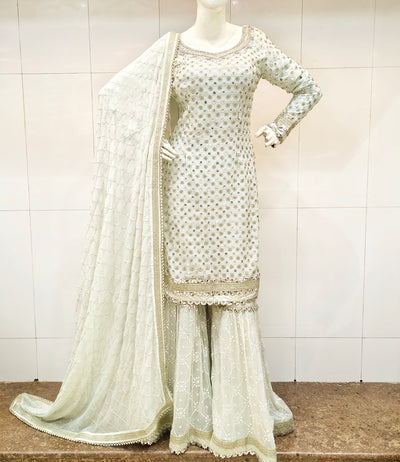 Off White traditional outfit with a matching dupatta with delicate self n gold work